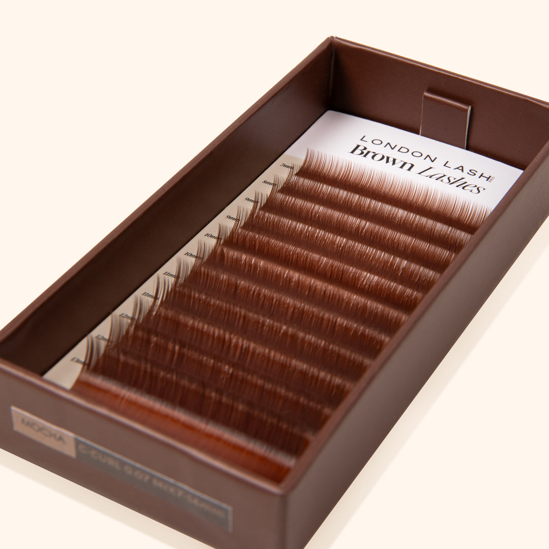 warm brown eyelash extensions inside brown lash tray 