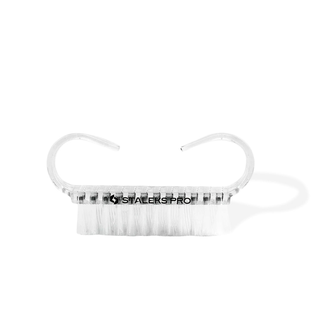 transparent plastic Staleks Manicure Brushes for Dust Removal with white fibers on the white background