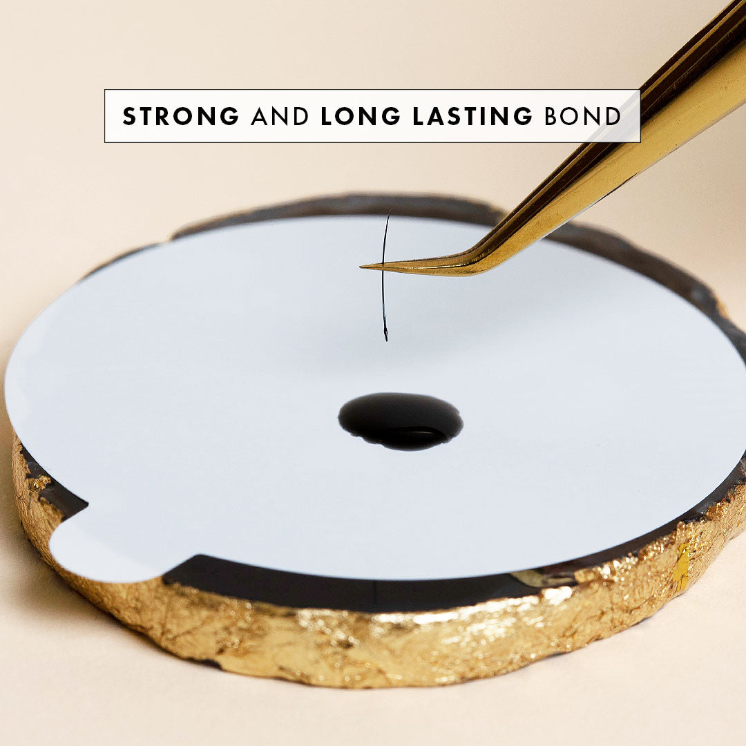 a drop of eyelash extension glue on a jade stone sticker