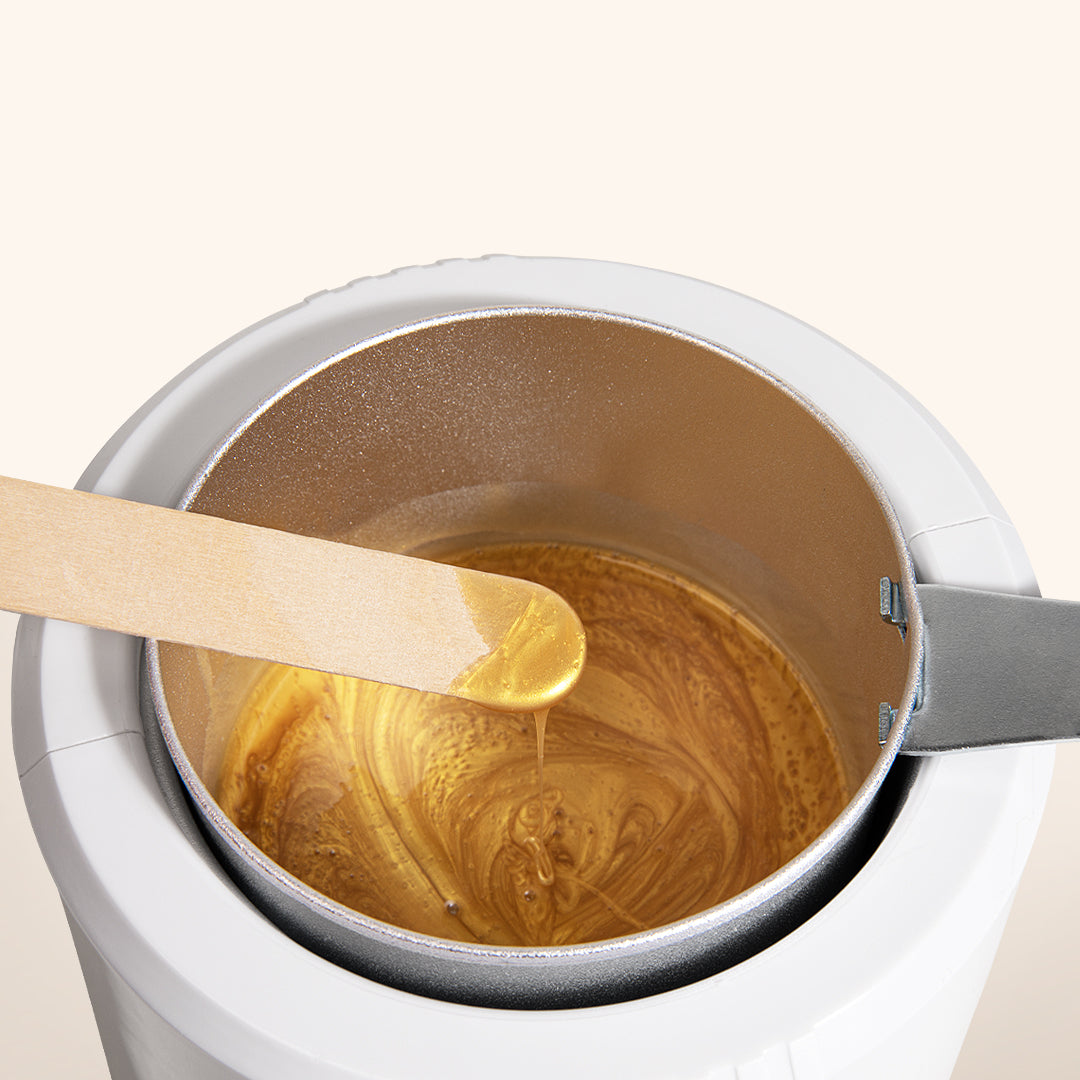 Wax heater with so henna gentle brow wax in to showcase viscosity and texture 