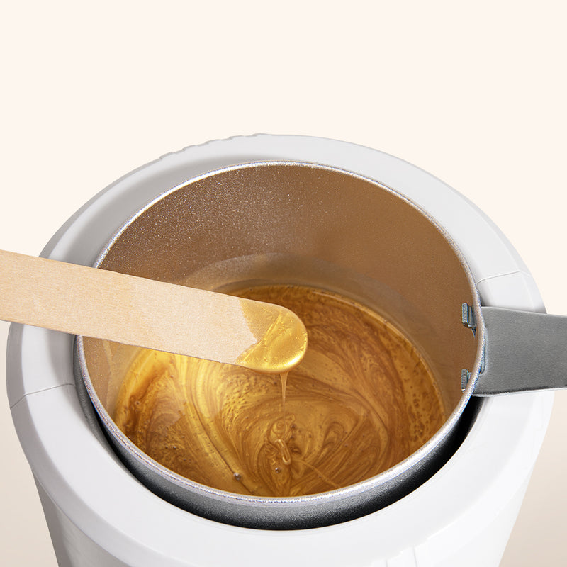 Wax heater with so henna gentle brow wax in to showcase viscosity and texture 